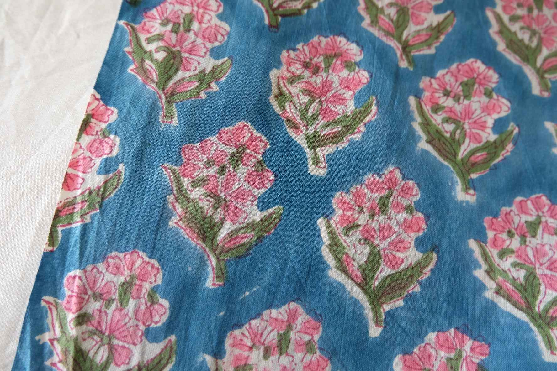 Indian Hand Block Printed Cotton Fabric – Pink Floral Motif on Blue – Sold by the Meter